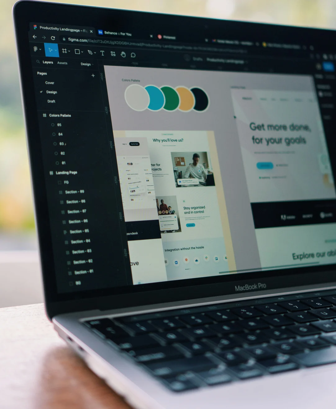 Laptop showing a landing page being designed