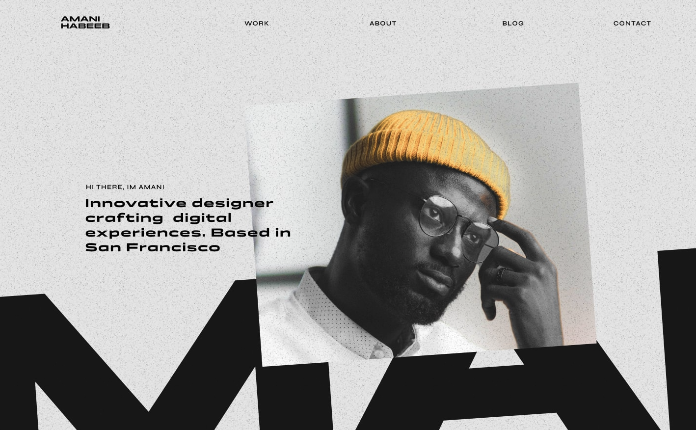 A black man with a yellow hat is featured in the hero section of the Anchiano Webflow Portfolio template!