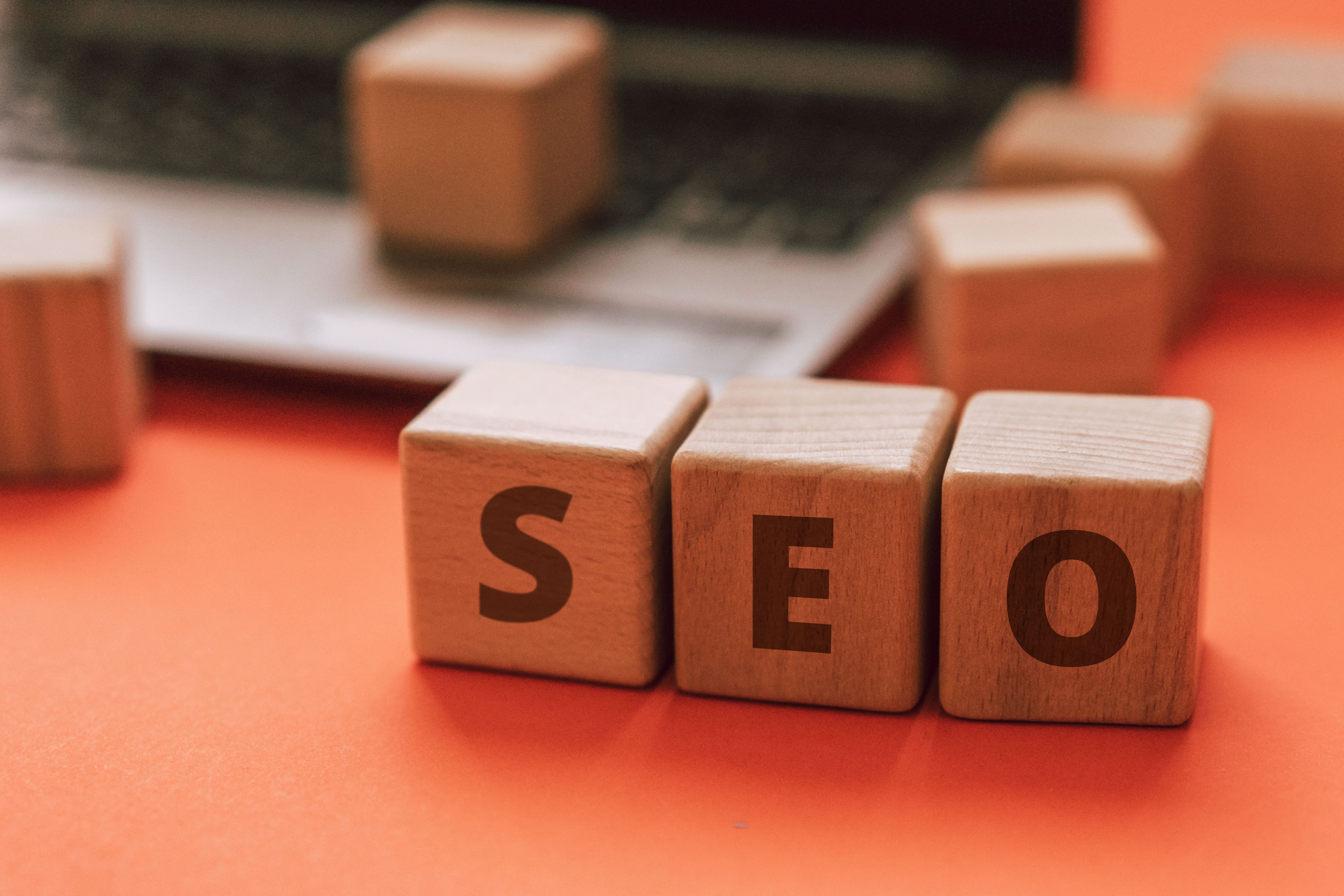 A picture with some SEO written little cubes